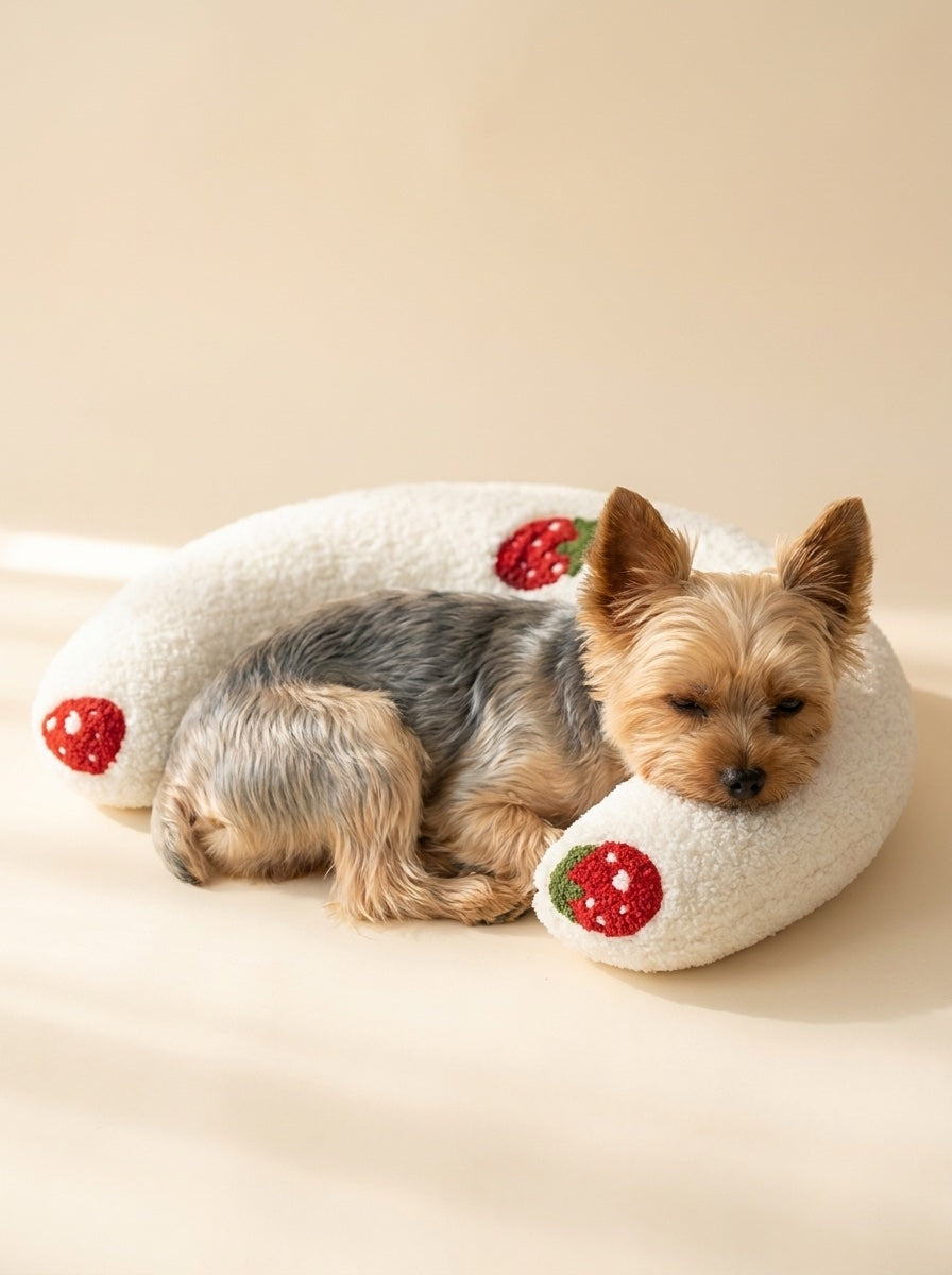 Small dog resting chin on a PawCalm U-shape pillow